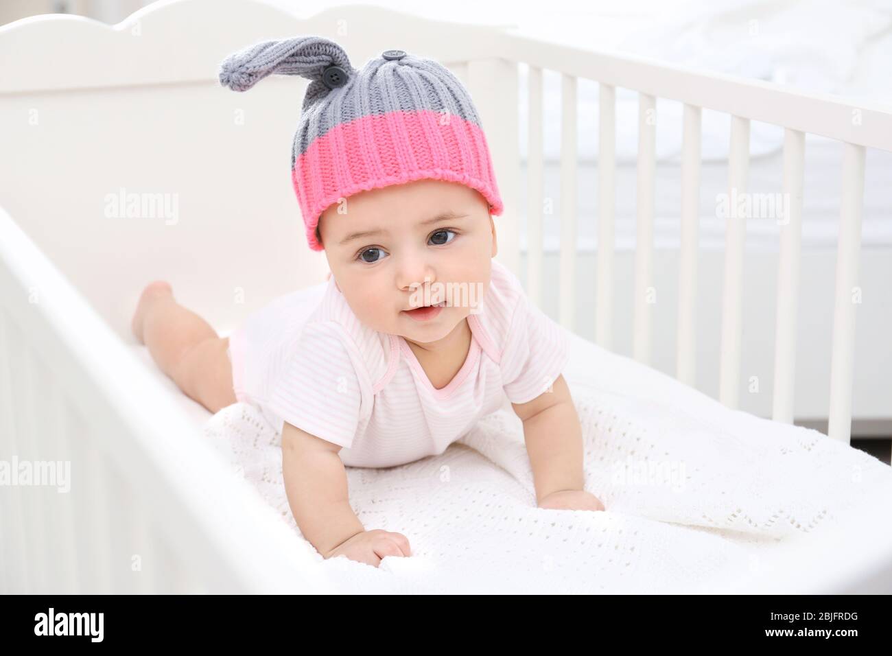 Cute little baby in cradle at home Stock Photo Alamy