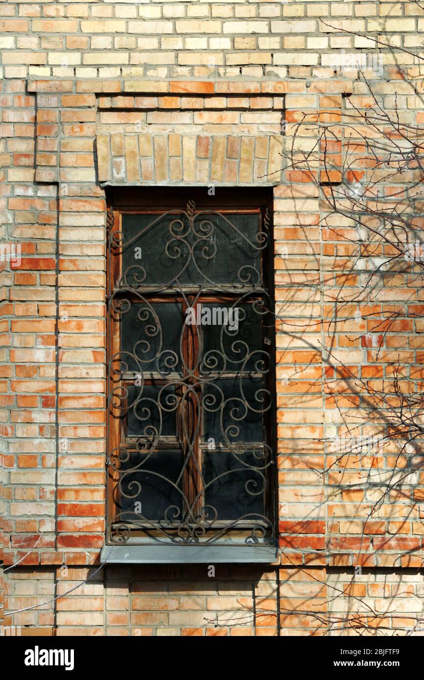 Brick building with wooden window Stock Photo - Alamy