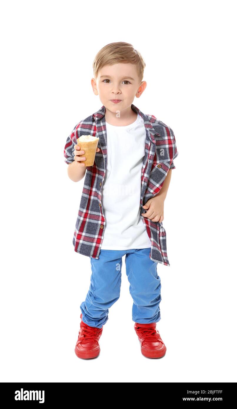 Cute little boy eating ice cream on white background Stock Photo