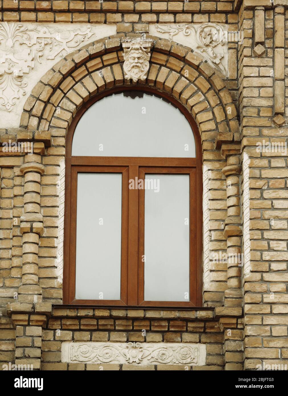 Arched window with brick wall background Stock Photo - Alamy