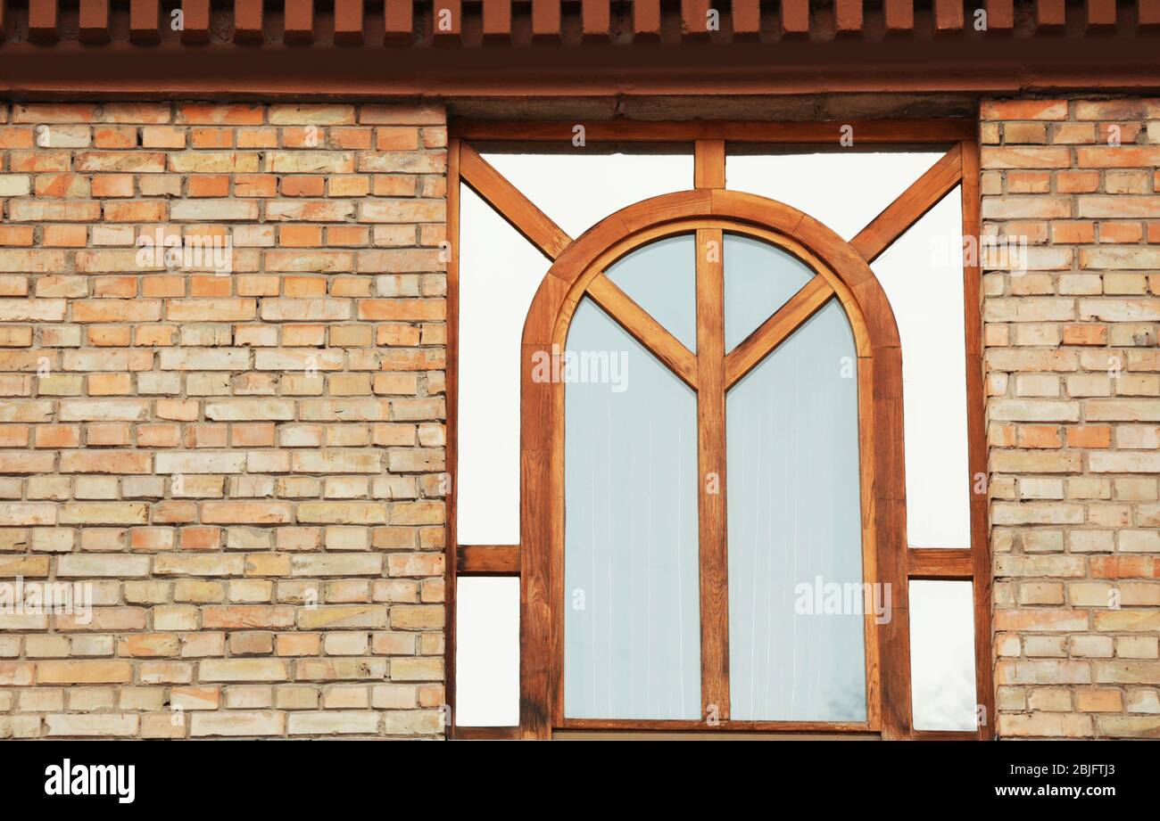 Wooden window with toned glass and brick wall background Stock Photo ...
