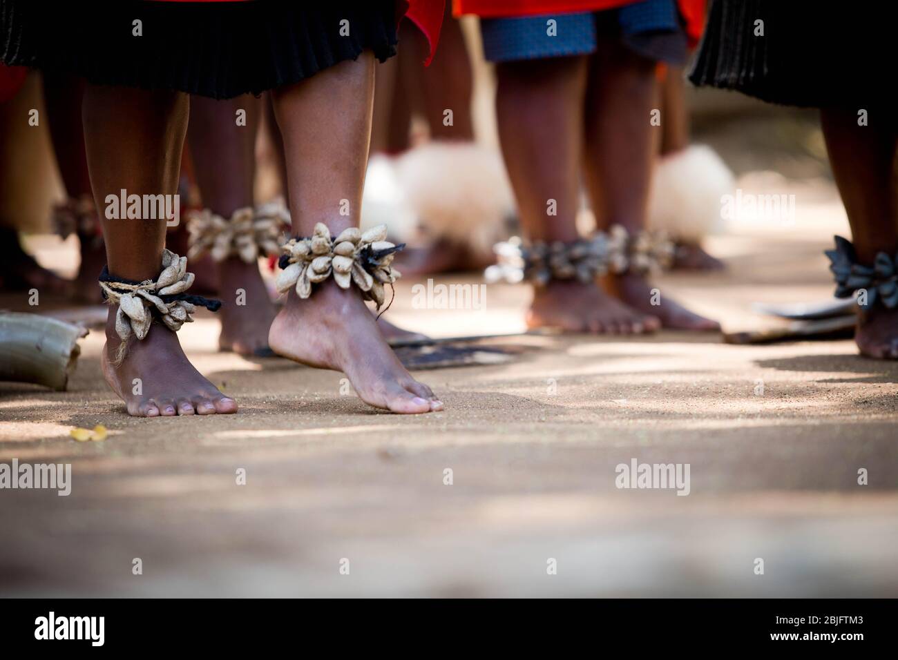A woman makes the first step of the national african dance Stock Photo