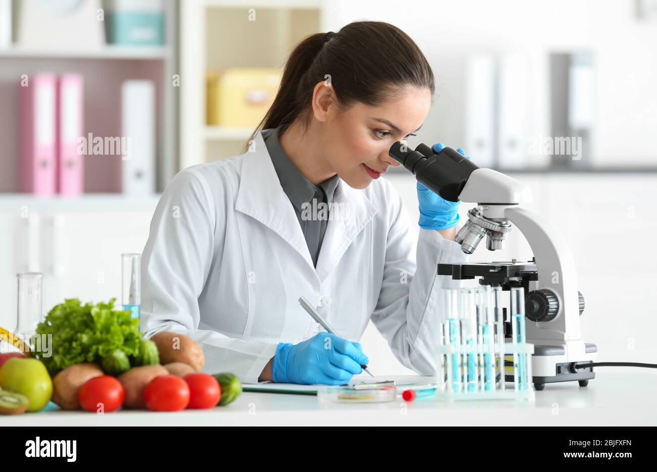 Nutiritonal Lab Examples Young female nutritionist testing food samples in laboratory Stock ...