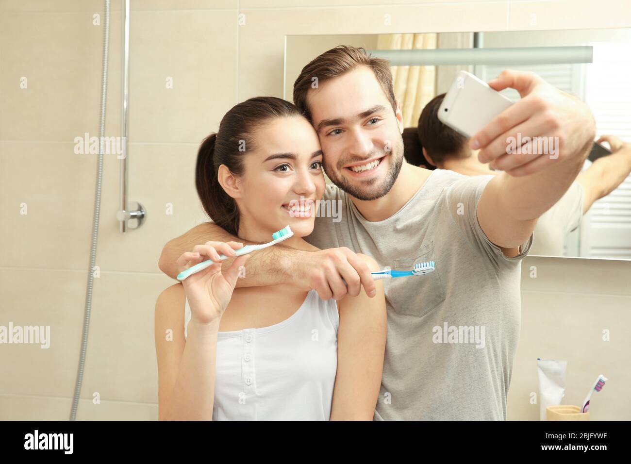 Woman taking selfie in bathroom hi-res stock photography and images - Alamy