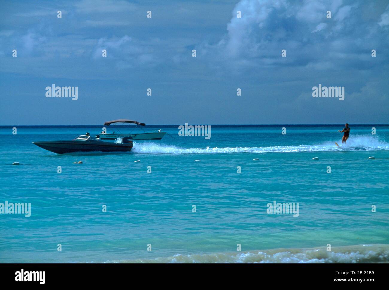 Dickenson Bay Antigua Speedboat and Water Skier Stock Photo
