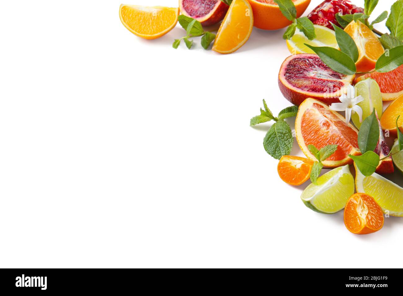 Composition of citrus fruits and green leaves on white background Stock ...
