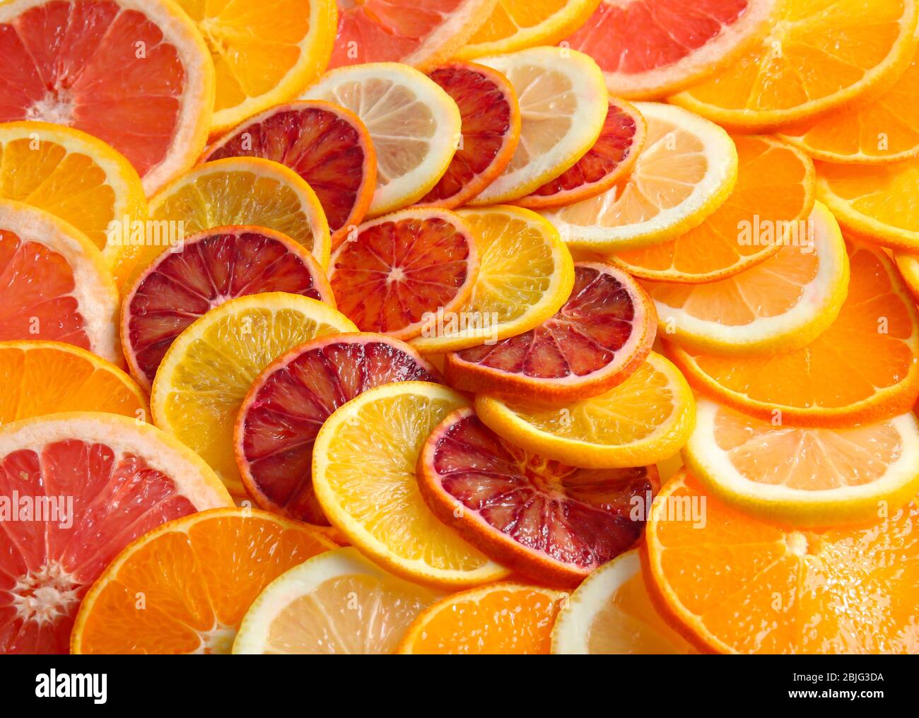 Citrus slices as background Stock Photo - Alamy