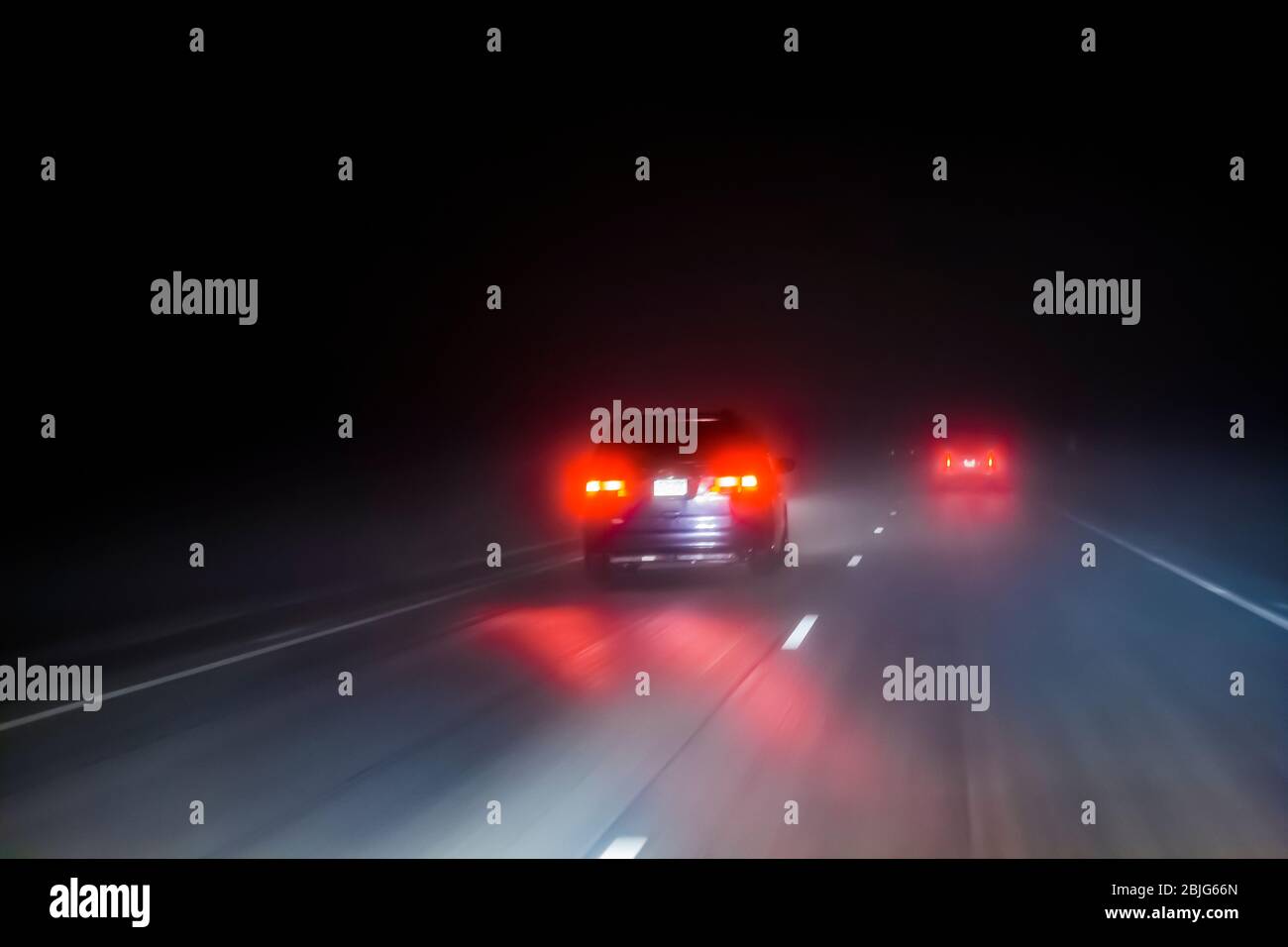 Driving during rainy, foggy condidtions at night along Interstate 90 in in Minnesota, USA [No property release; available for editorial licensing only Stock Photo