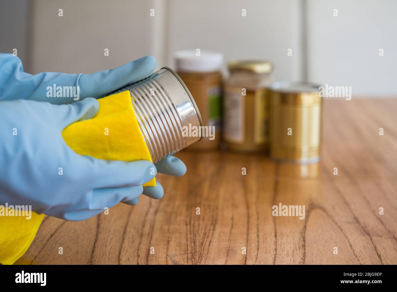Disinfecting food with rubbing alcohol for prevention of coronavirus covid-19. Stock Photo