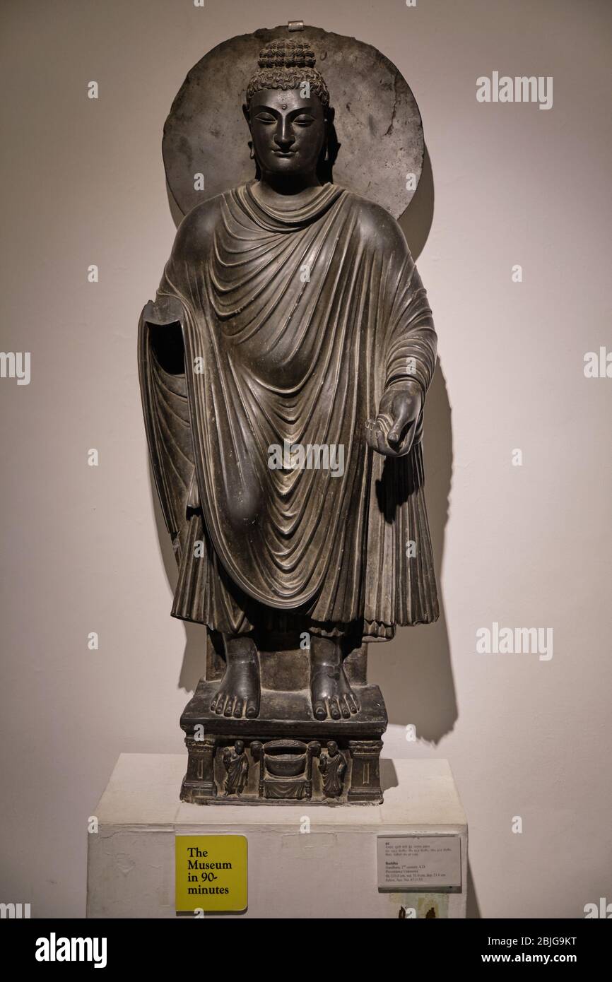New Delhi / India - September 26, 2019: 2nd century Greco-Buddhist statue of standing Buddha from Gandhara, in the National Museum of India in New Del Stock Photo