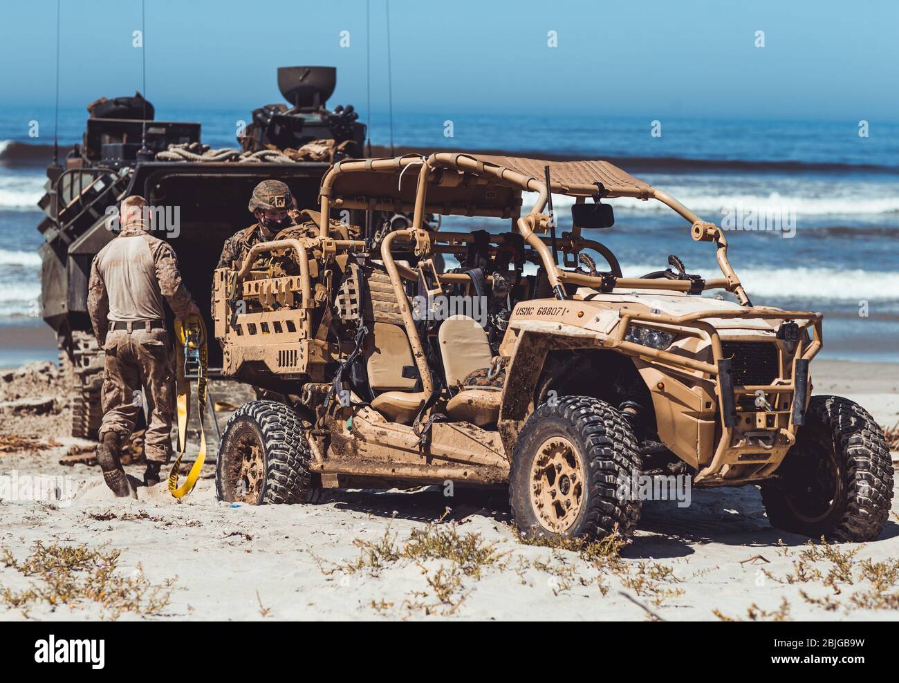 U.S. Marines assigned to I Marine Expeditionary Force Information Group, I Marine Expeditionary Force, prepare to load a Polaris MRZR D4 onto an AAV-7A1 during a field exercise on Marine Corps Base Camp Pendleton, California, April 23, 2020. The MRZR is designed to rapidly concentrate and disperse forces by providing assault and raid capabilities. (U.S. Marine Corps photo by Sgt. Manuel A. Serrano) Stock Photo