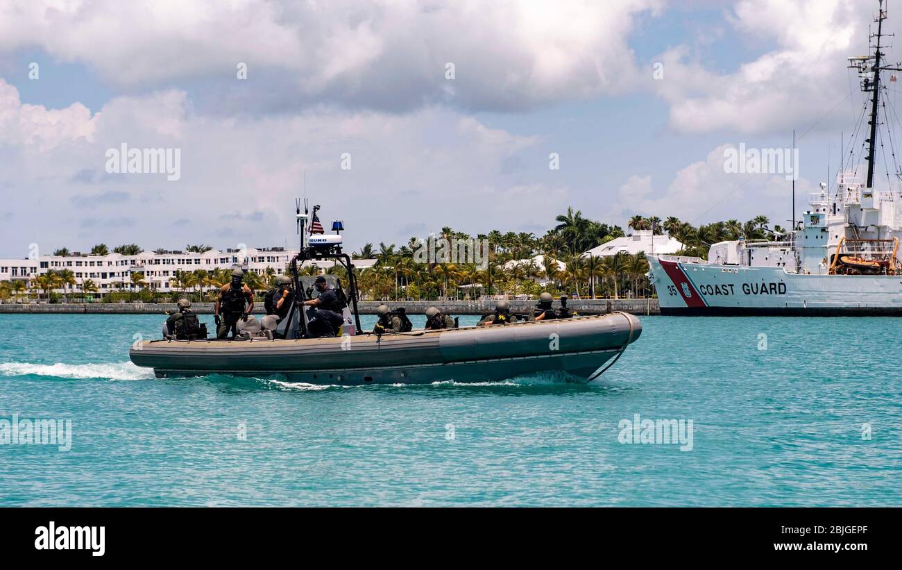 KEY WEST, Fla. (April 21, 2020) Sailors assigned to the Freedom-class littoral combat ship USS Detroit (LCS 7) prepare to conduct visit, board, search and seizure training on a tugboat while in port at Key West, Fla. Detroit is deployed to the U.S. Southern Command area of responsibility to support Joint Interagency Task Force South's mission, which includes counter illicit drug trafficking in the Caribbean and Eastern Pacific. (U.S. Navy photo by Mass Communication Specialist 2nd Class Anderson W. Branch/Released) Stock Photo