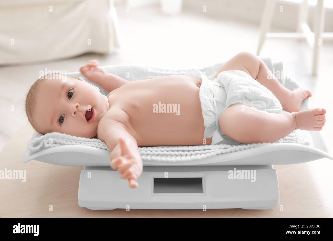 Newborn Baby On Scale. Physical Development Concept Photo Of Child Health  Care. Copy Space Stock Photo, Picture and Royalty Free Image. Image  45837323.