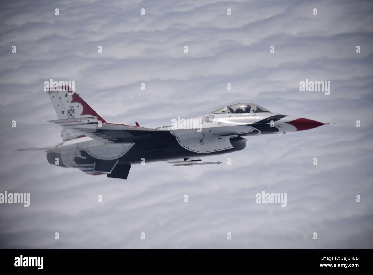 A U.S. Air Force Thunderbird F-16 Fighting Falcon flies in support of the America Strong campaign, April 28, 2020. The KC-10 Extenders assigned to Joint Base McGuire-Dix-Lakehurst, N.J., refueled the Thunderbirds and U.S. Navy Blue Angels during the America Strong flyovers of New York, New Jersey and Philadelphia to honor the healthcare workers, essential employees, military personnel and other first responders on the front line of the battle against COVID-19. (U.S. Air Force photo by 1st Lt. Katie Mueller) Stock Photo