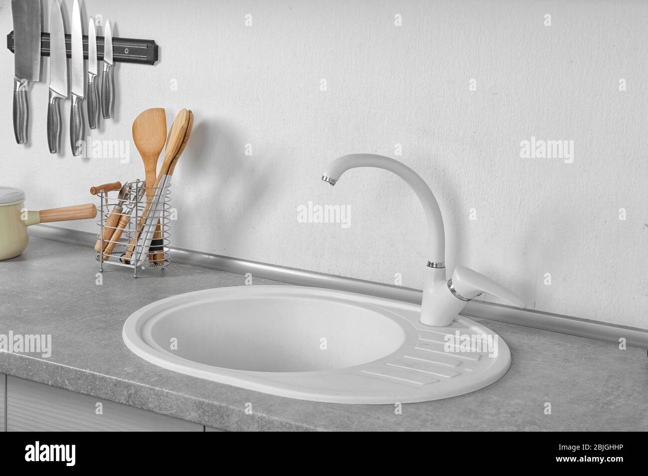 Sink in beautiful modern kitchen Stock Photo - Alamy