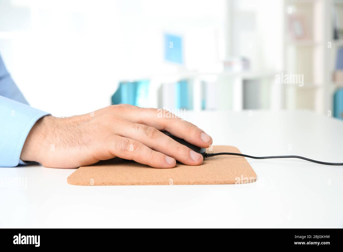 Hand on mouse mat hi-res stock photography and images - Alamy