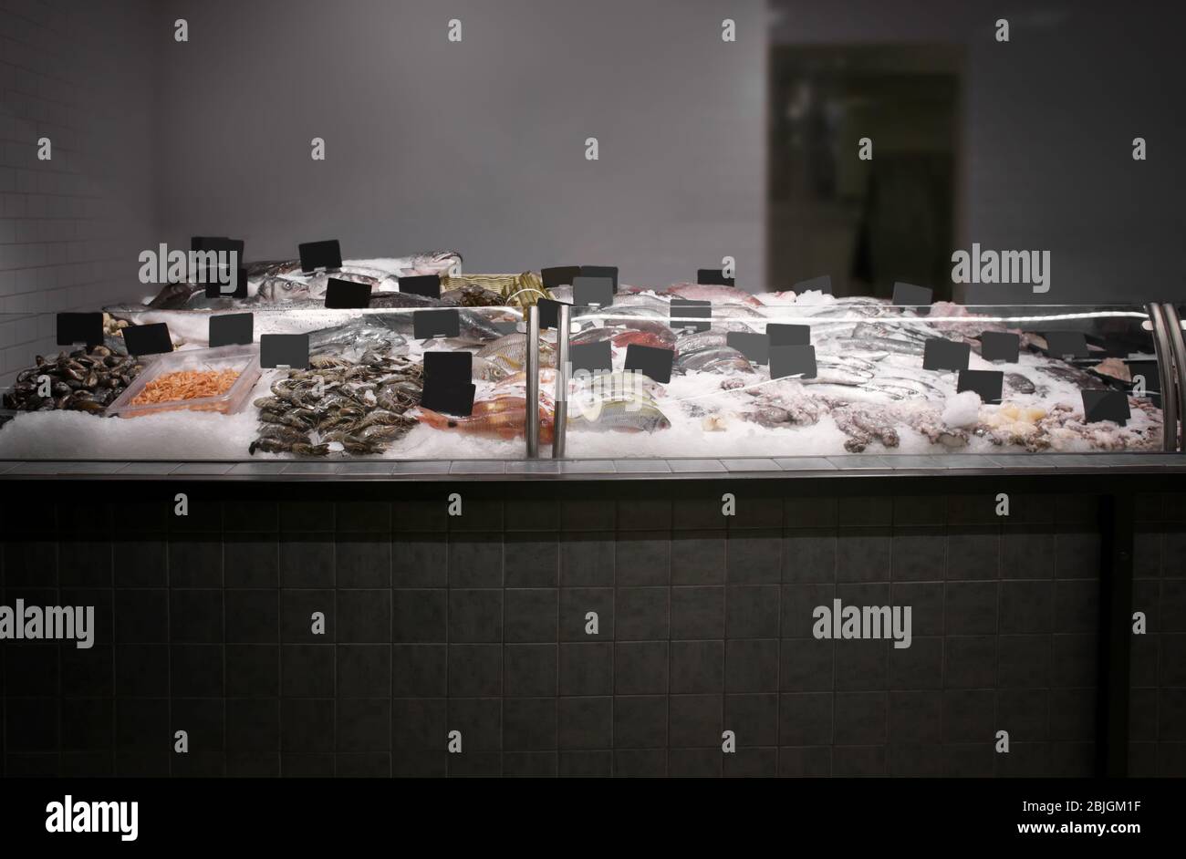 Fresh fish and other seafood in supermarket Stock Photo - Alamy