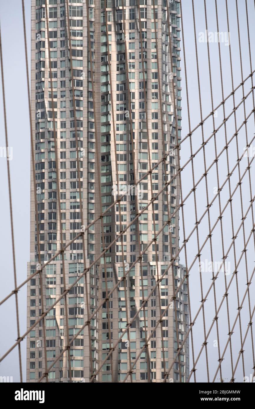 waves and silver reflections of Frank Gehry's 8 Spruce Street tower in New York City Stock Photo