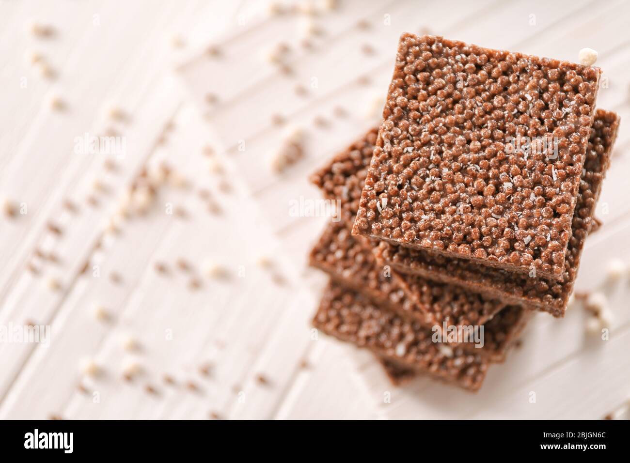 Delicious chocolate rice treats on light background Stock Photo - Alamy