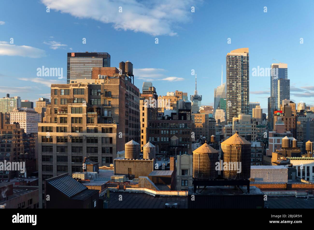 View across the rooftops of midtown, Manhattan towards skyscrapers Stock Photo