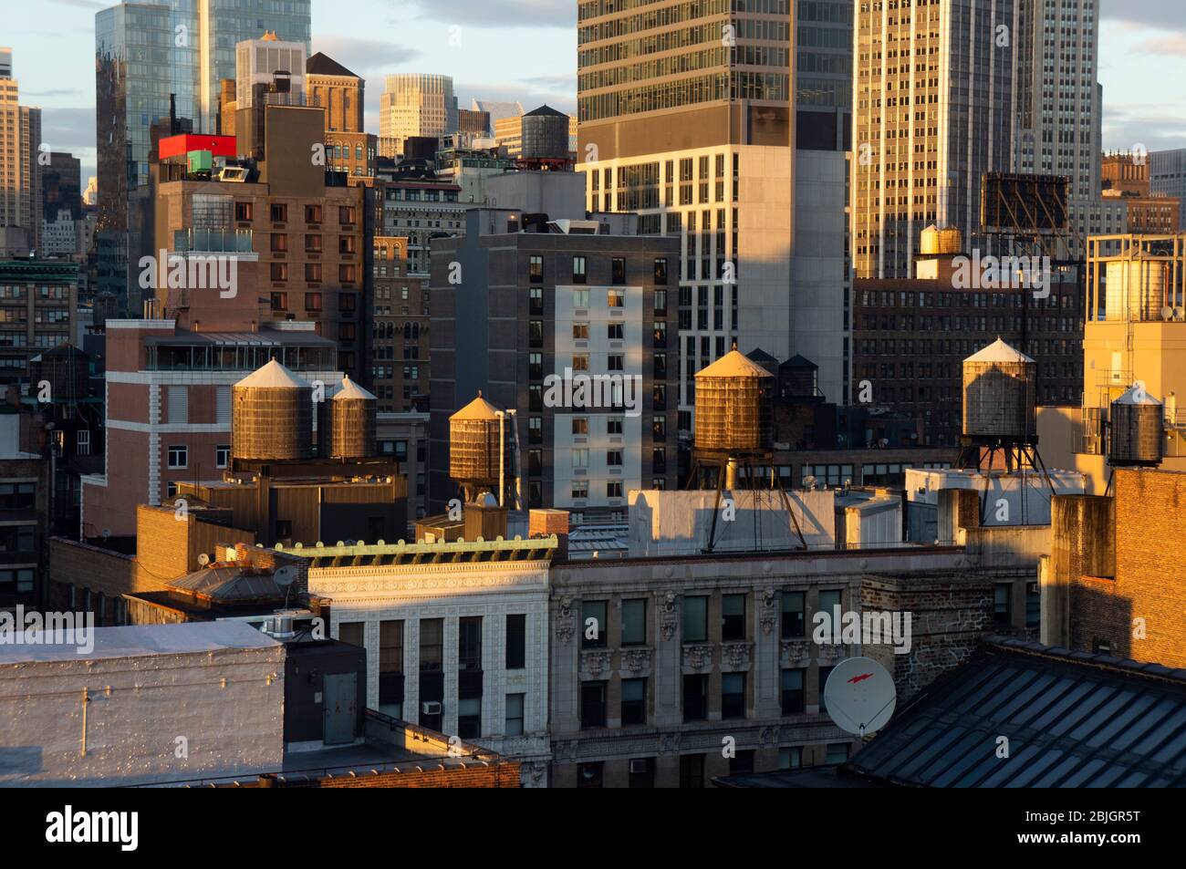 View across rooftops of Manhattan with iconic water tanks of New York Stock Photo