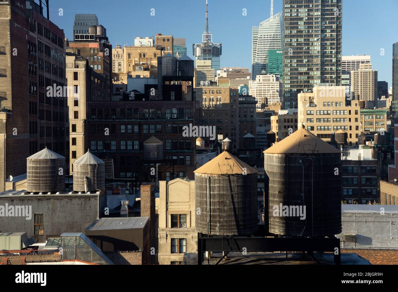 View across rooftops of Manhattan with iconic water tanks of New York Stock Photo