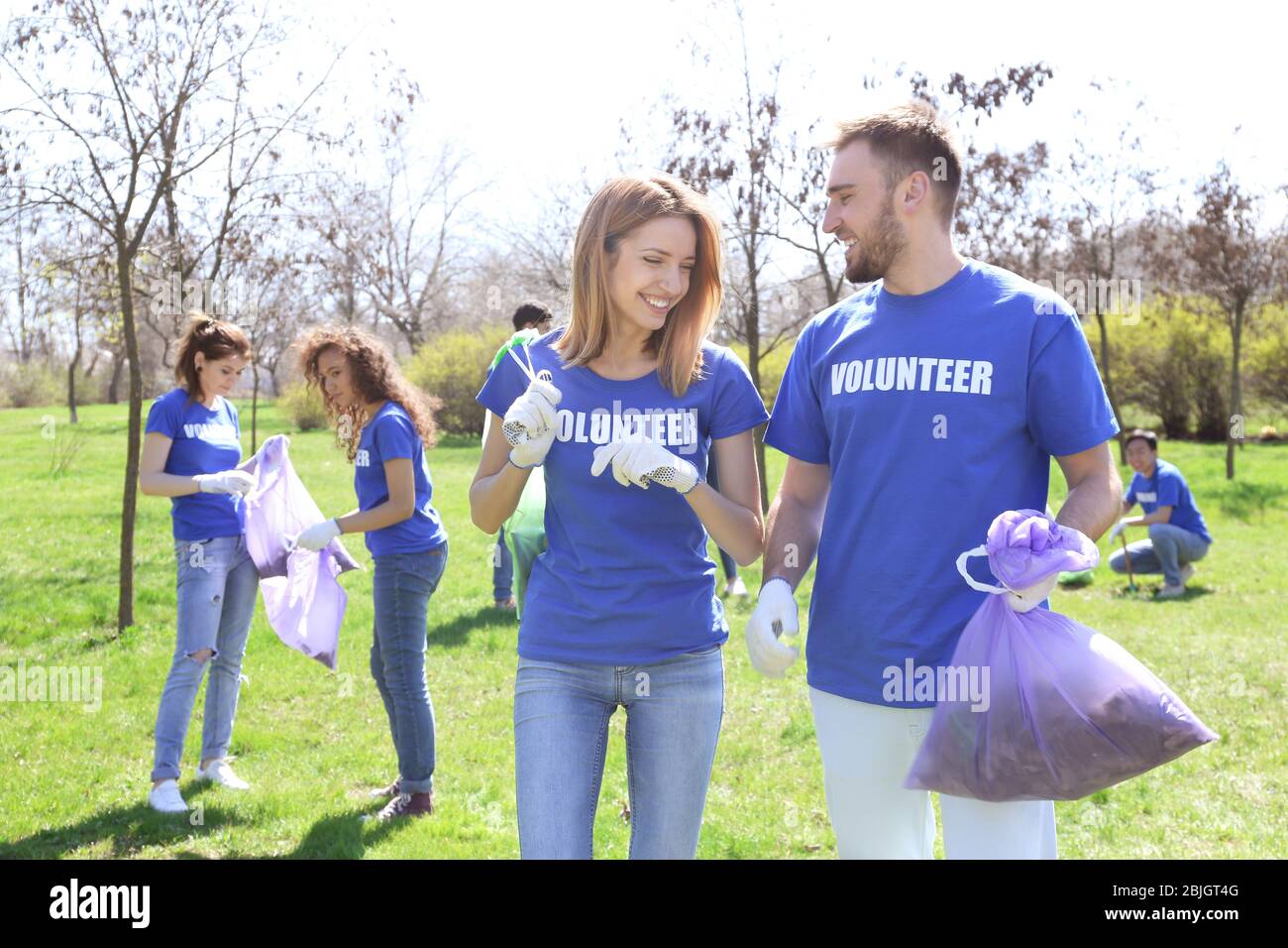 Female volunteers young trees hi-res stock photography and images - Alamy