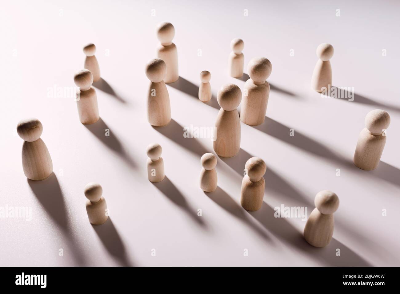 Groups of people have to keep separate to avoid contagion, symbolic image concept with white background. Stock Photo