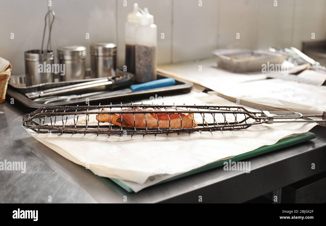 Fish Fillet Racks Delicious fish fillet in grill rack on table Stock Photo - Alamy