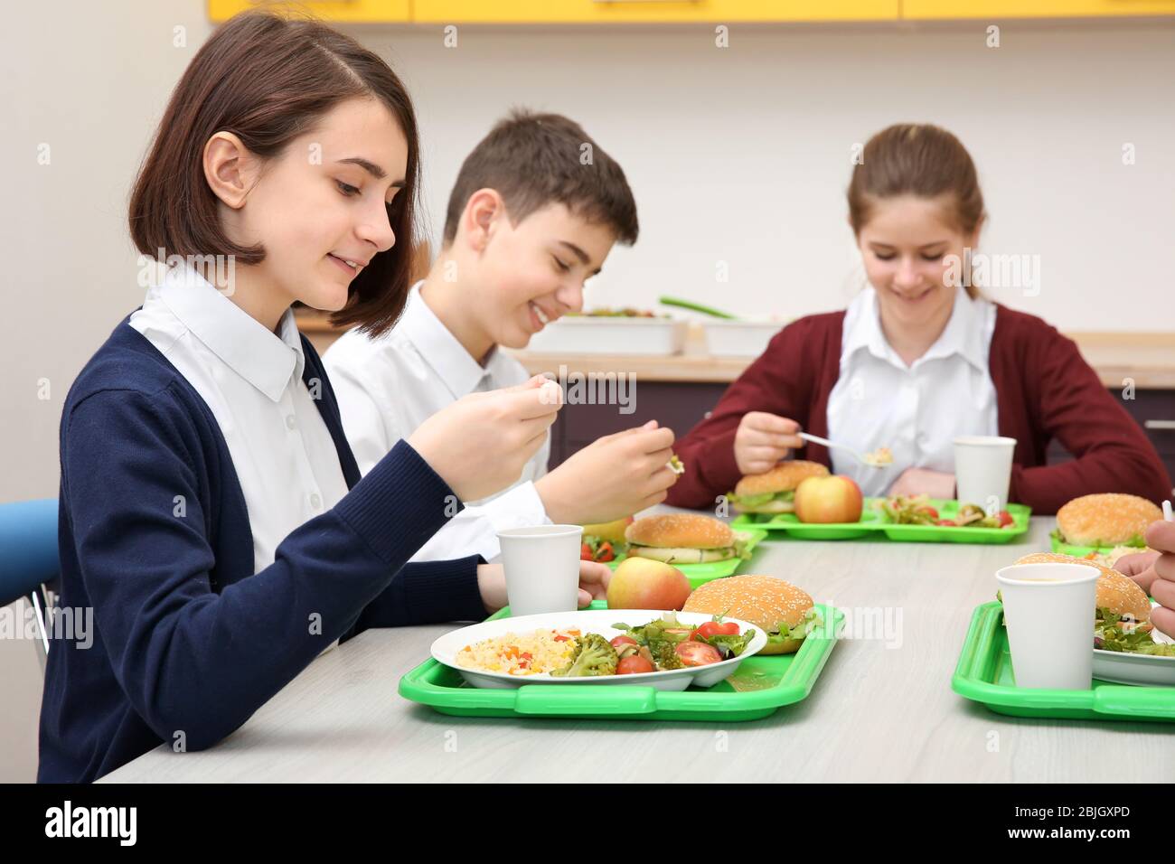 Kids eating lunch at the canteen illustration Stock Vector Image & Art -  Alamy