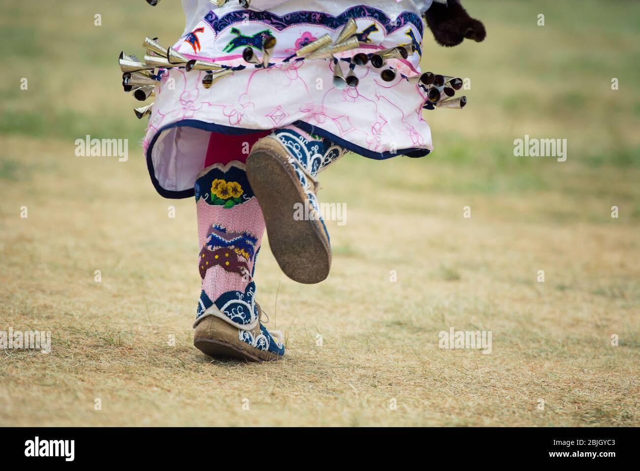 Native Female Dancer's Feet in Beaded Moccasin Boots, Mukluks, Traditional Regalia, Six Nations of the Grand River, Pow Wow Stock Photo