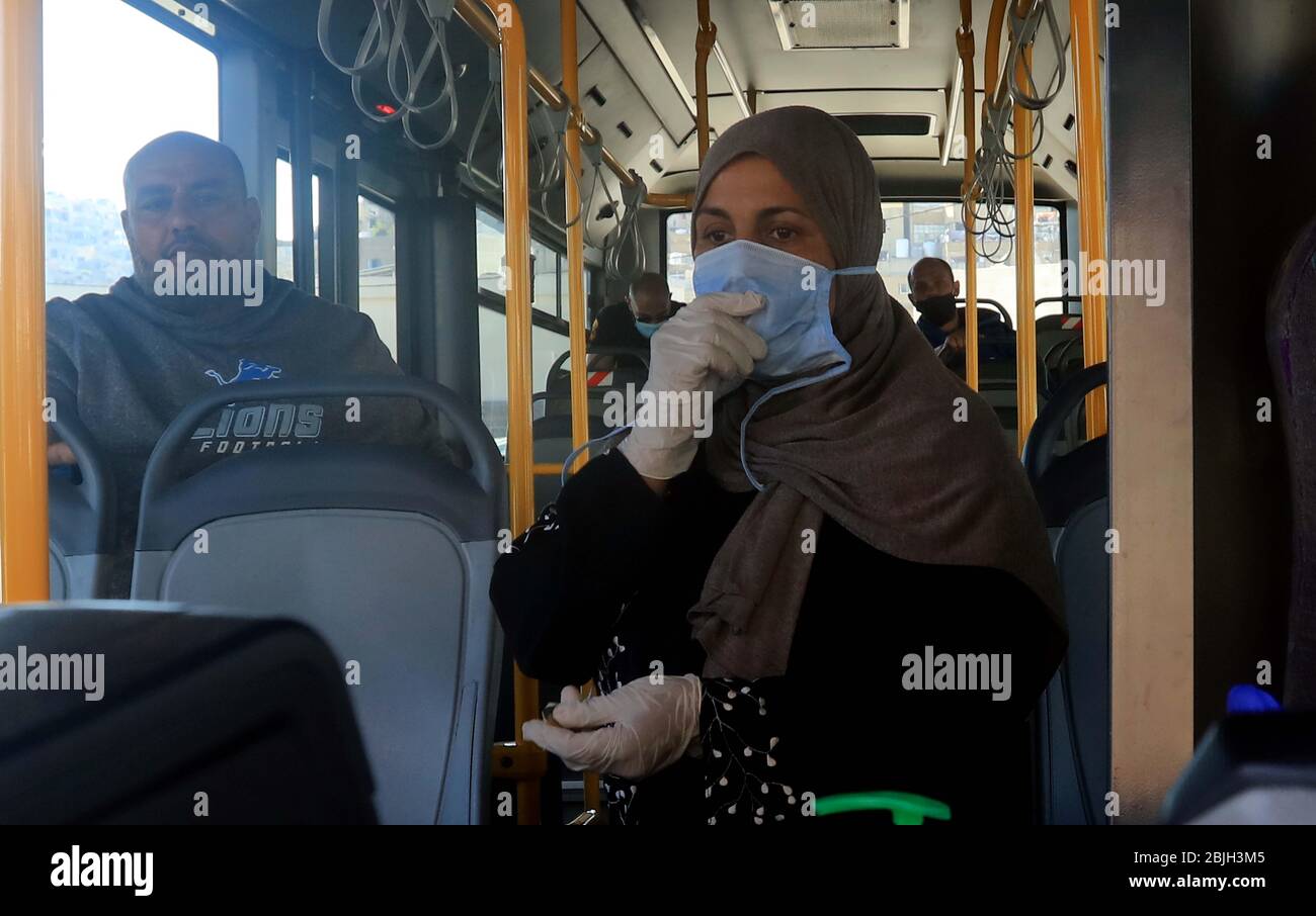 Amman, Jordan. 29th Apr, 2020. People ride a bus in Amman, Jordan, on April 29, 2020. Jordanian Health Minister Saad Jaber said Jordan reported two Arab drivers were confirmed to be infected with COVID-19 on Wednesday at the border, bringing the total number of infections in the country to 451, with eight fatalities. Credit: Mohammad Abu Ghosh/Xinhua/Alamy Live News Stock Photo