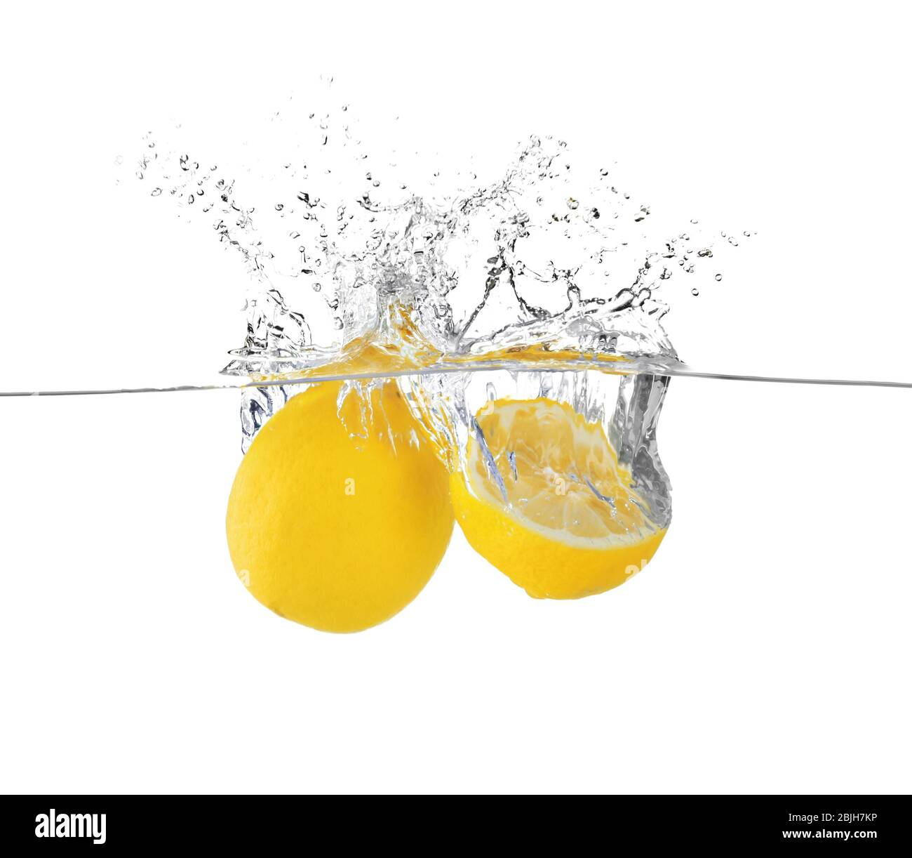 Fresh lemons in water on white background Stock Photo