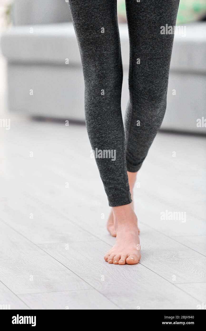 Young girl in grey pants for yoga Stock Photo
