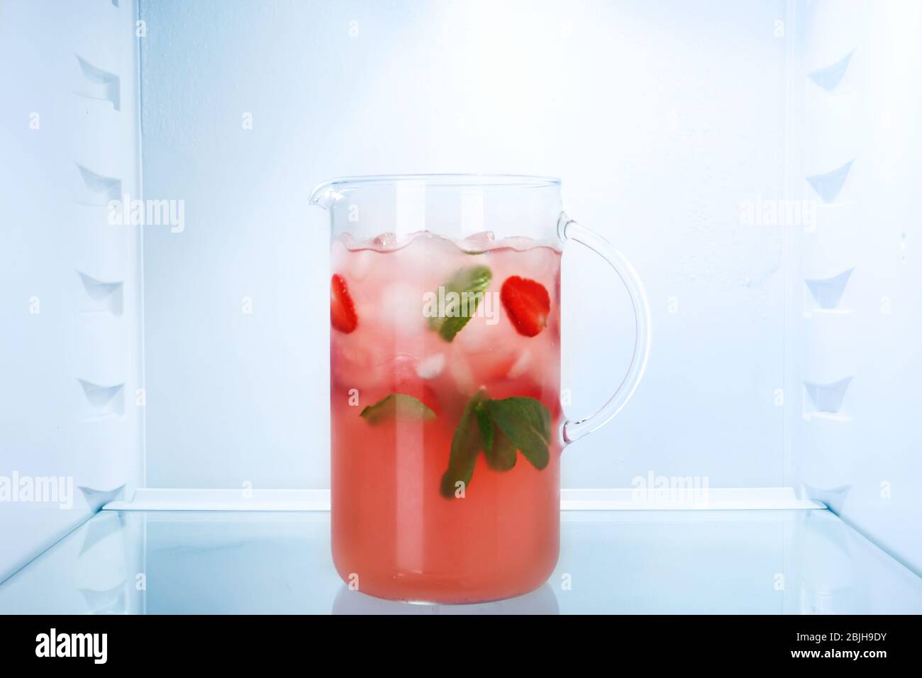 Jug of fresh strawberry lemonade in fridge Stock Photo Alamy