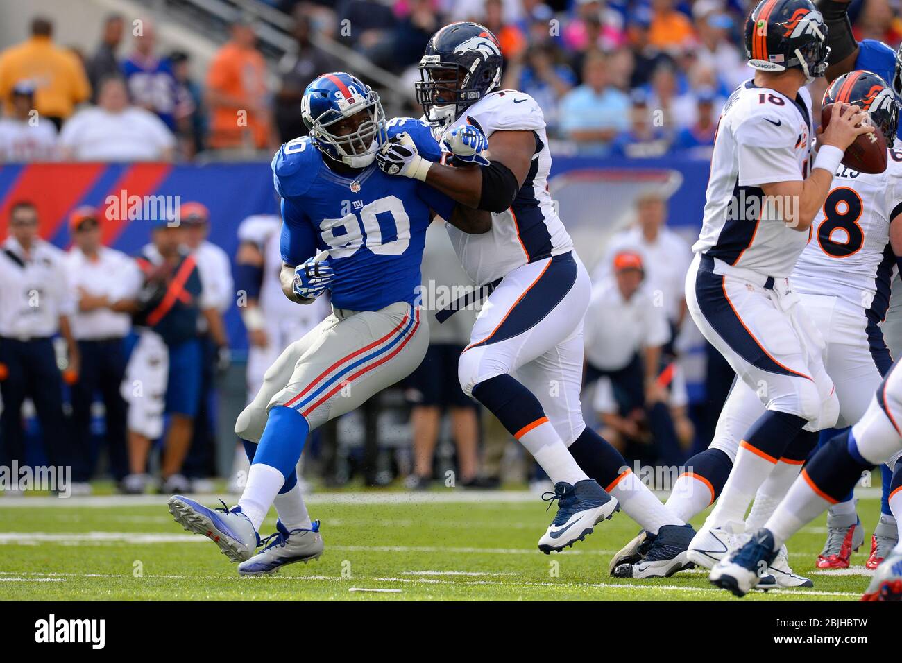 September 15, 2013: New York Giants defensive end Jason Pierre-Paul (90) applies pressure to Denver Broncos tackle Ryan Clady (78) during the first ha Stock Photo