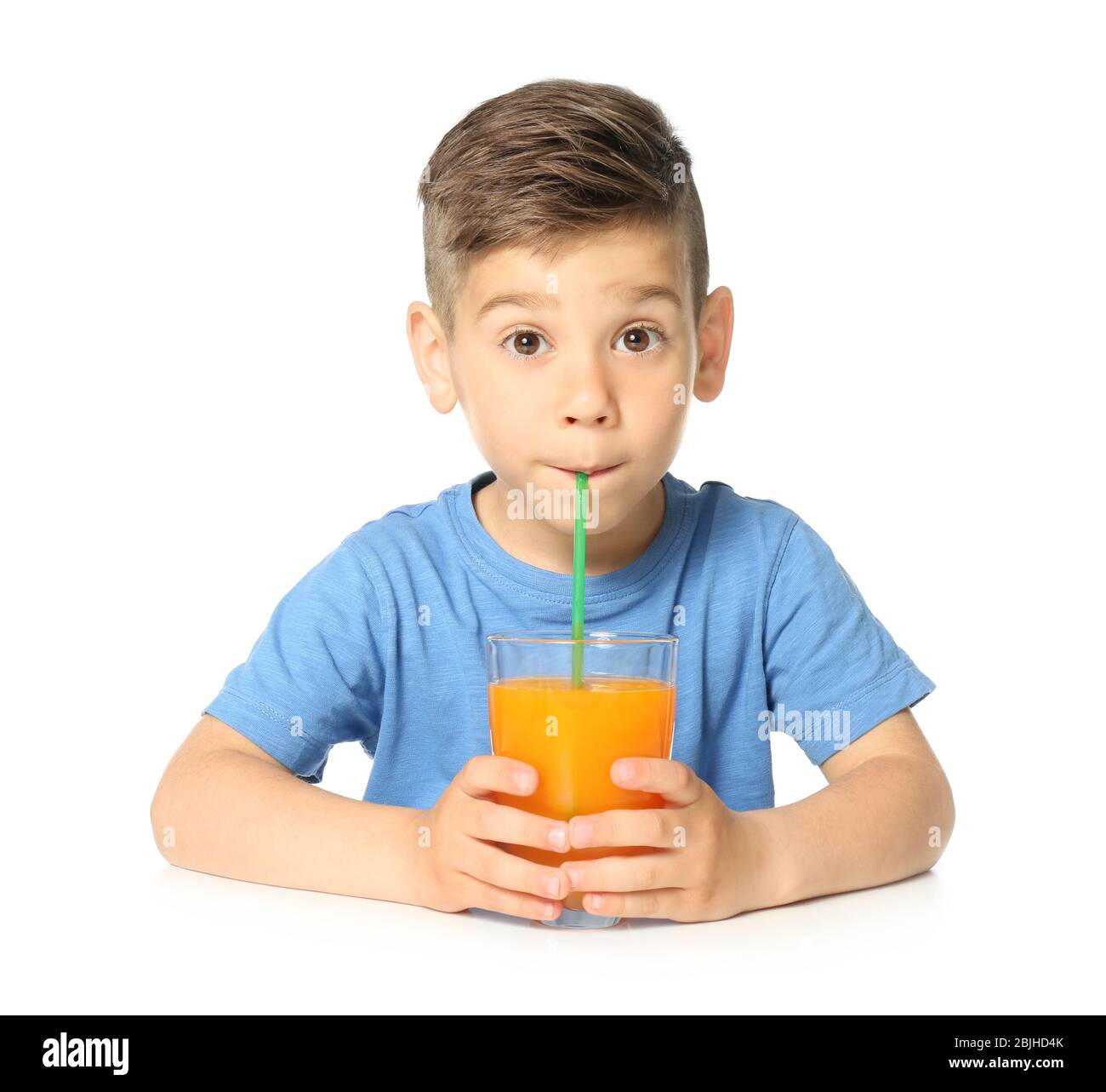 Cute little boy drinking juice on white background Stock Photo Alamy