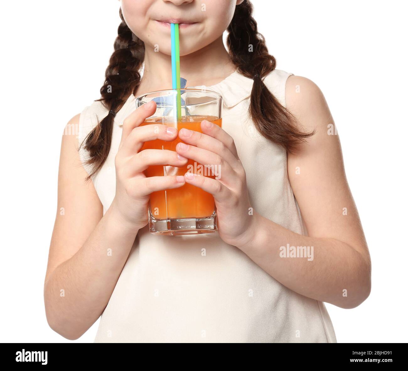 Cute little girl drinking juice on white background, closeup Stock ...