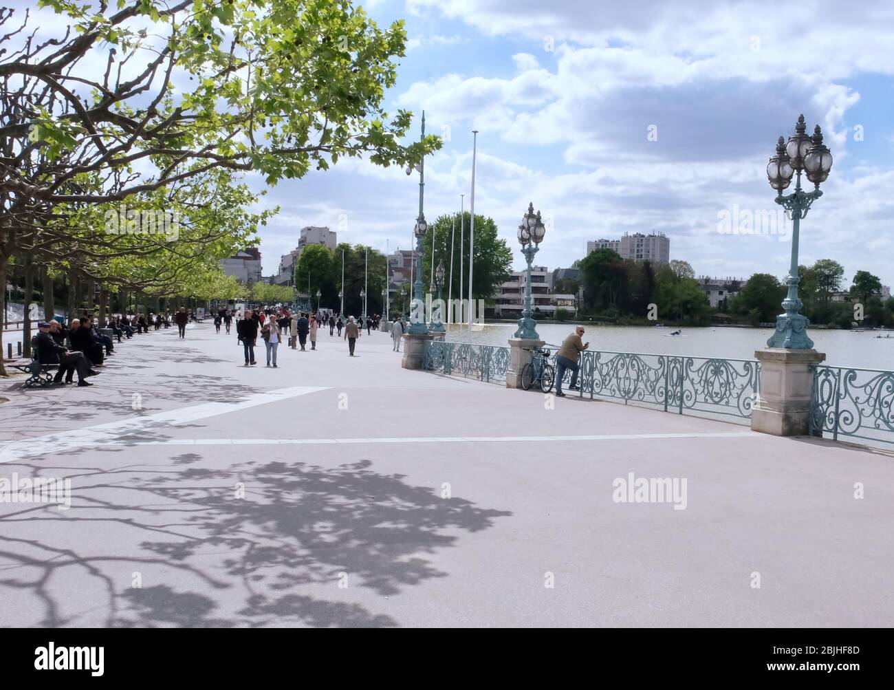 People walking on beautiful embankment in modern city Stock Photo - Alamy