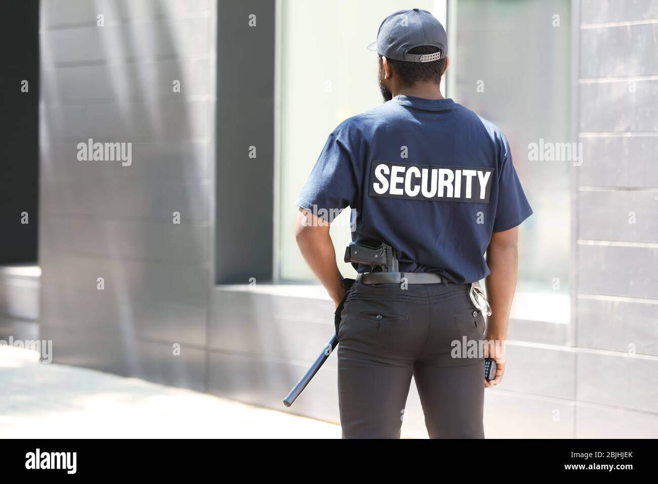 Male security guard outdoors Stock Photo - Alamy
