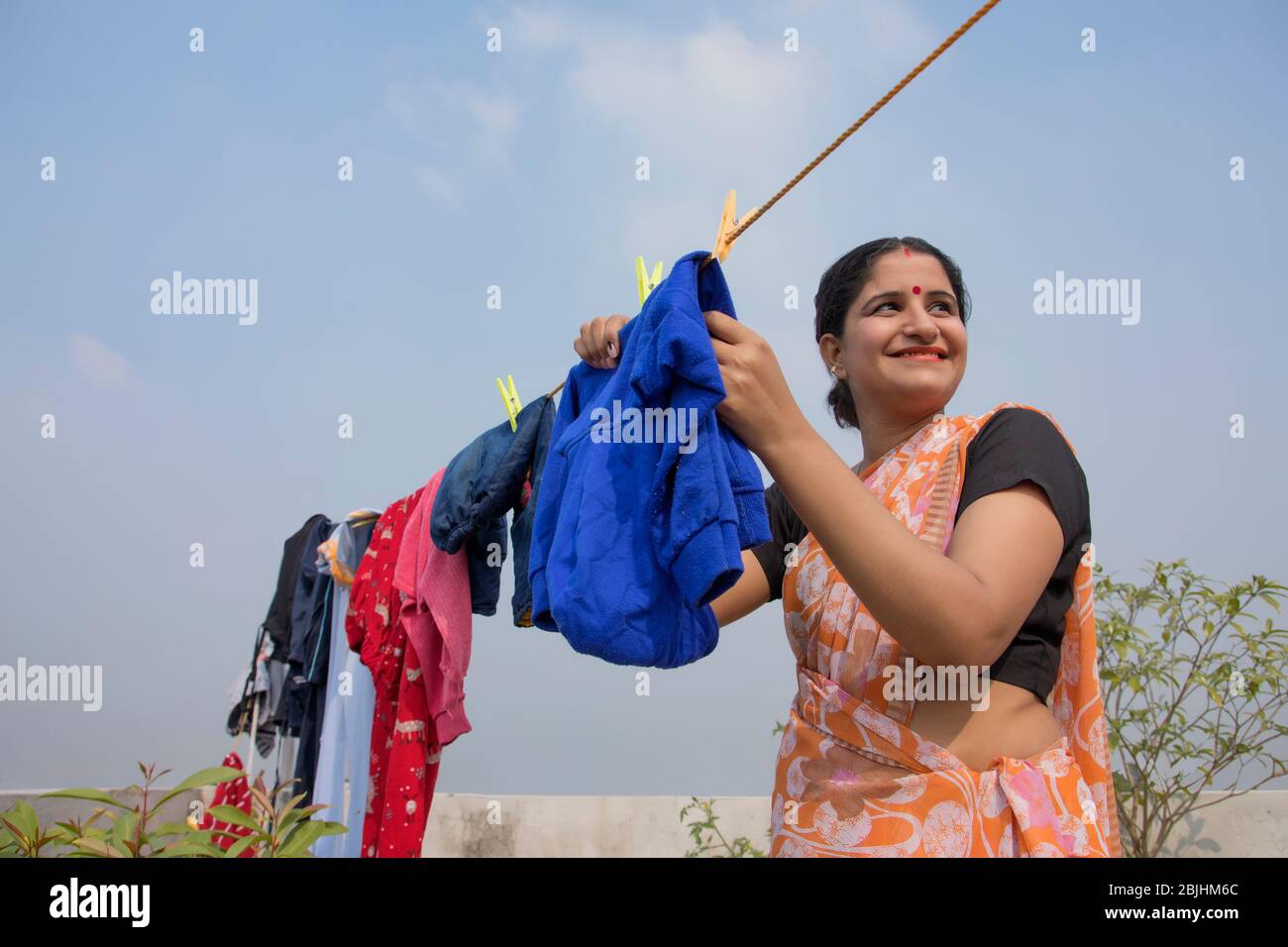 Indian woman drying clothes hires stock photography and images Alamy