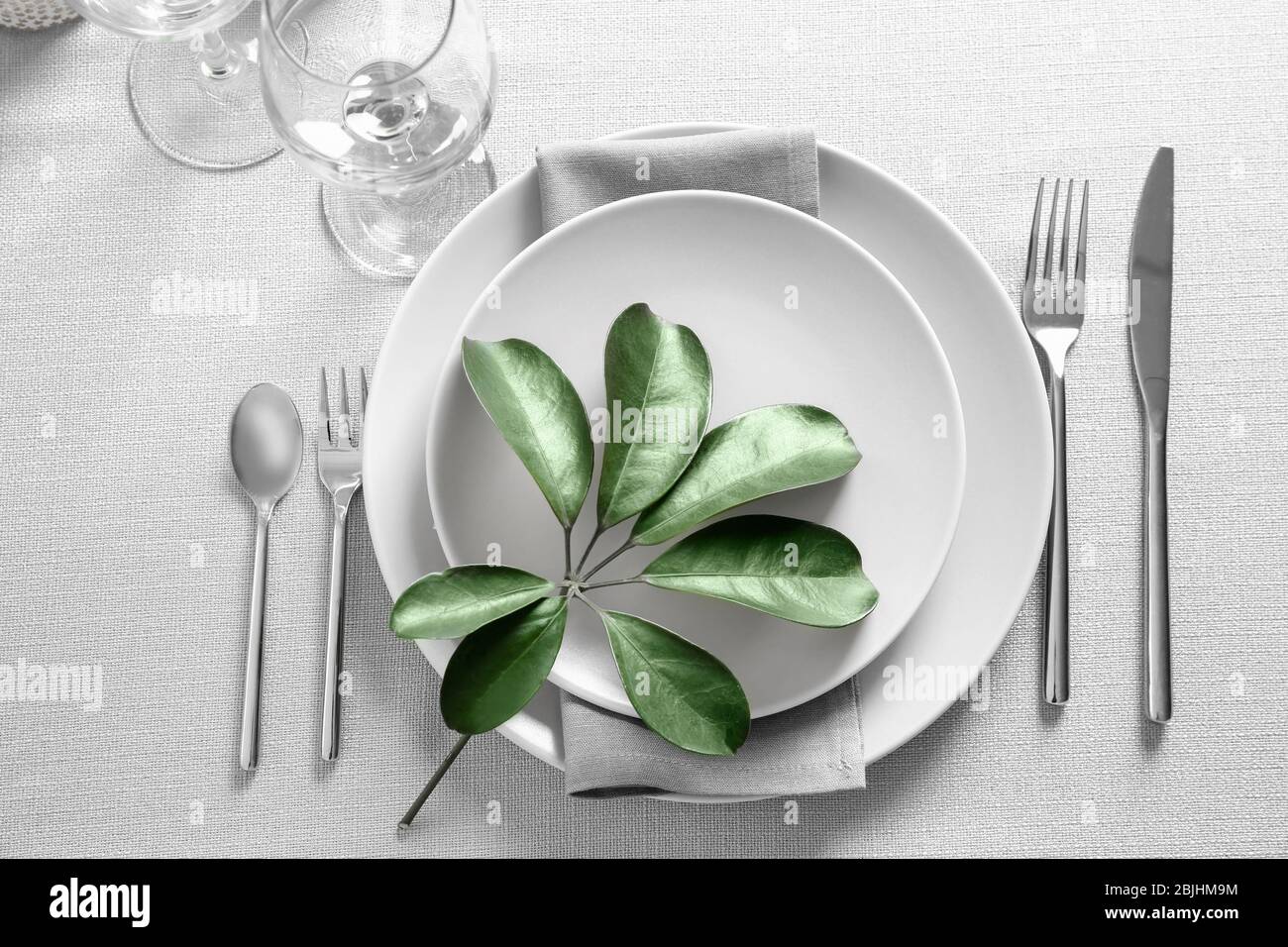 Beautiful table setting with green tropical leaf Stock Photo
