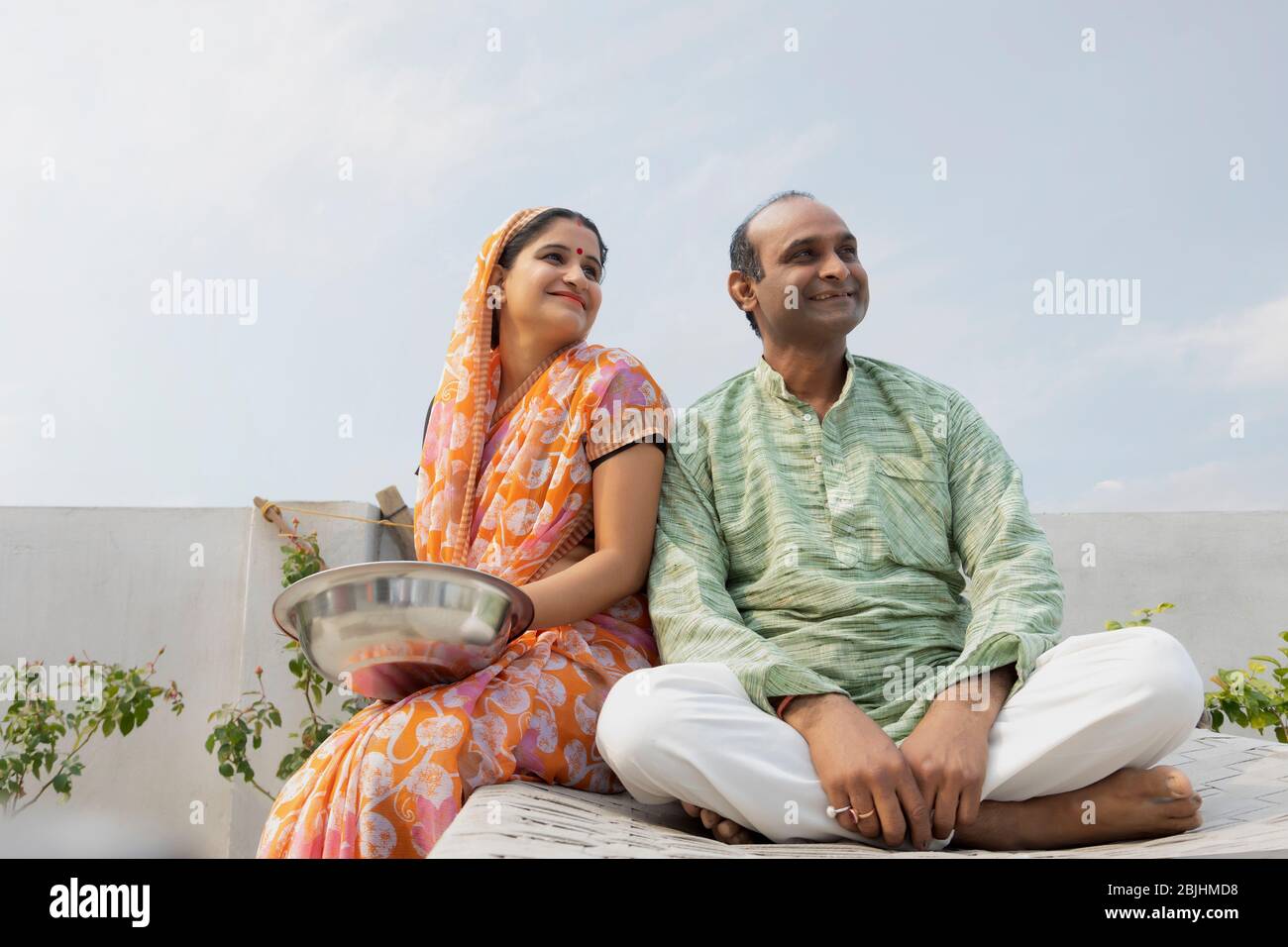Indian man sitting on roof hi-res stock photography and images - Alamy