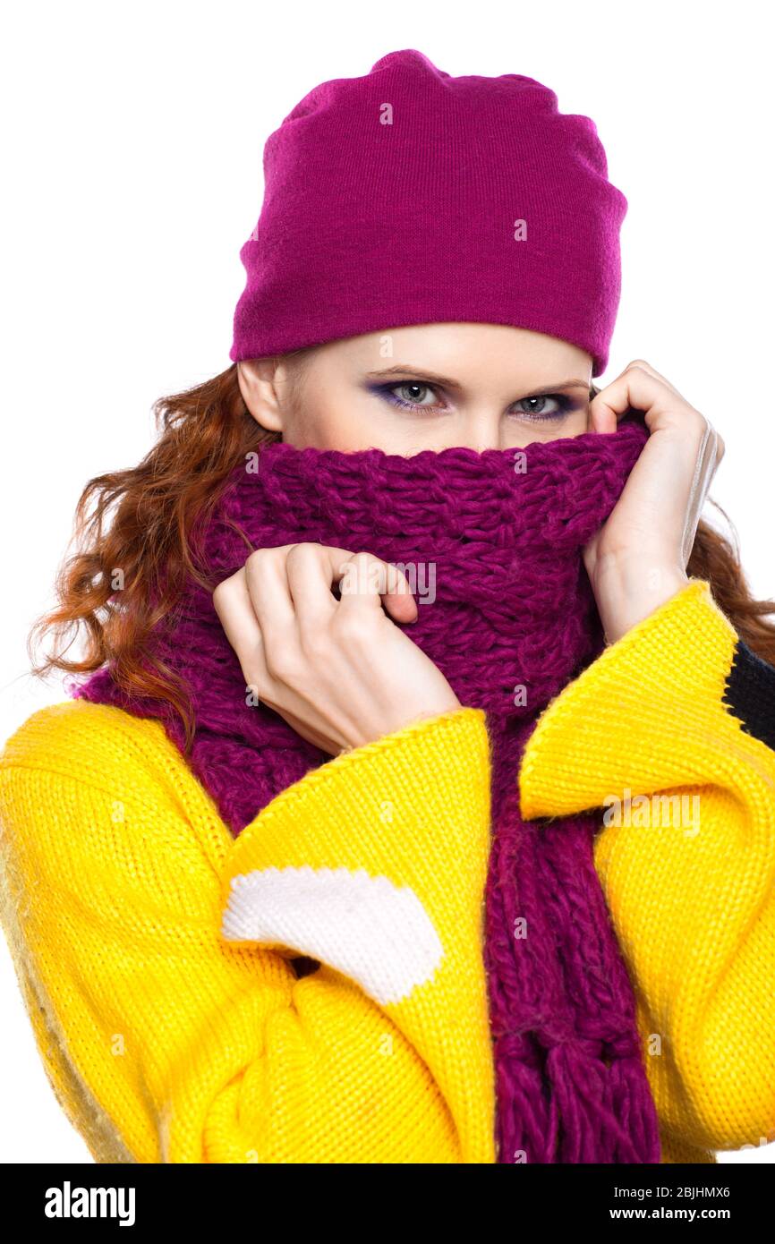Young woman in hat and scarf isolated on white background Stock Photo