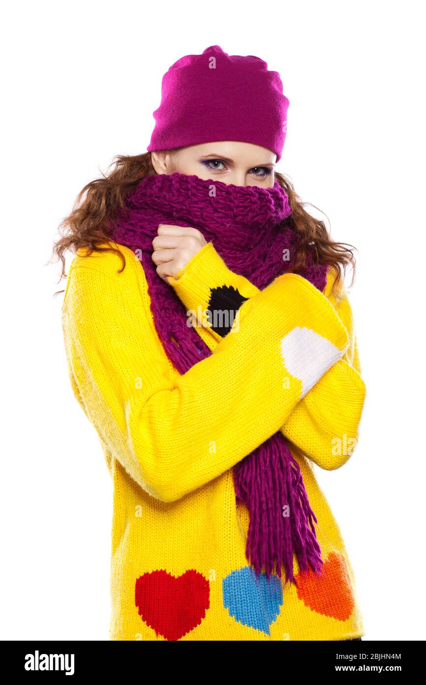 Young woman in hat and scarf isolated on white background Stock Photo