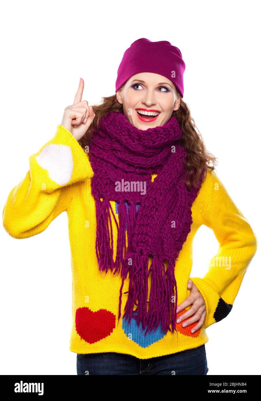 Young woman in hat and scarf isolated on white background with lifted up finger Stock Photo