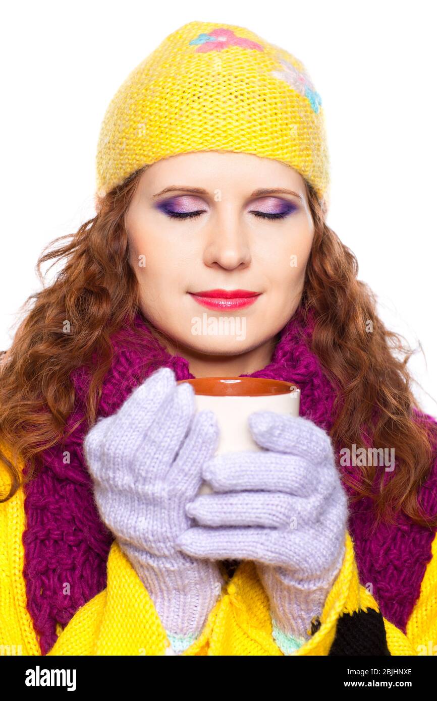 Young woman wearing winter clothes with cup of hot chocolate or coffee or tea Stock Photo