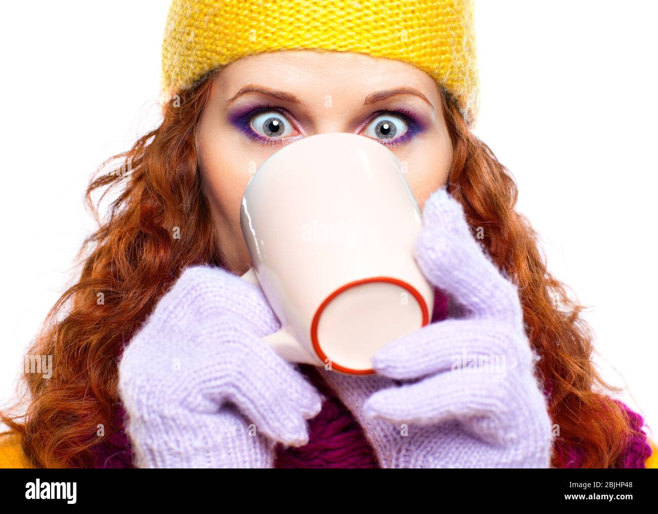 Young woman wearing winter clothes with cup of hot chocolate or coffee or tea Stock Photo