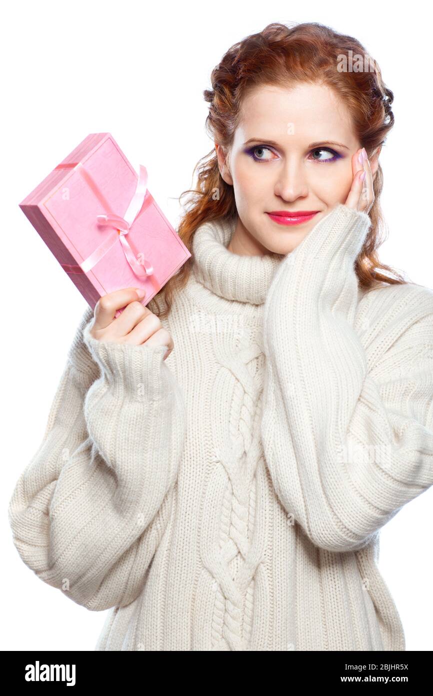 Beautiful woman in cashmere sweater with a gift isolated on white background Stock Photo