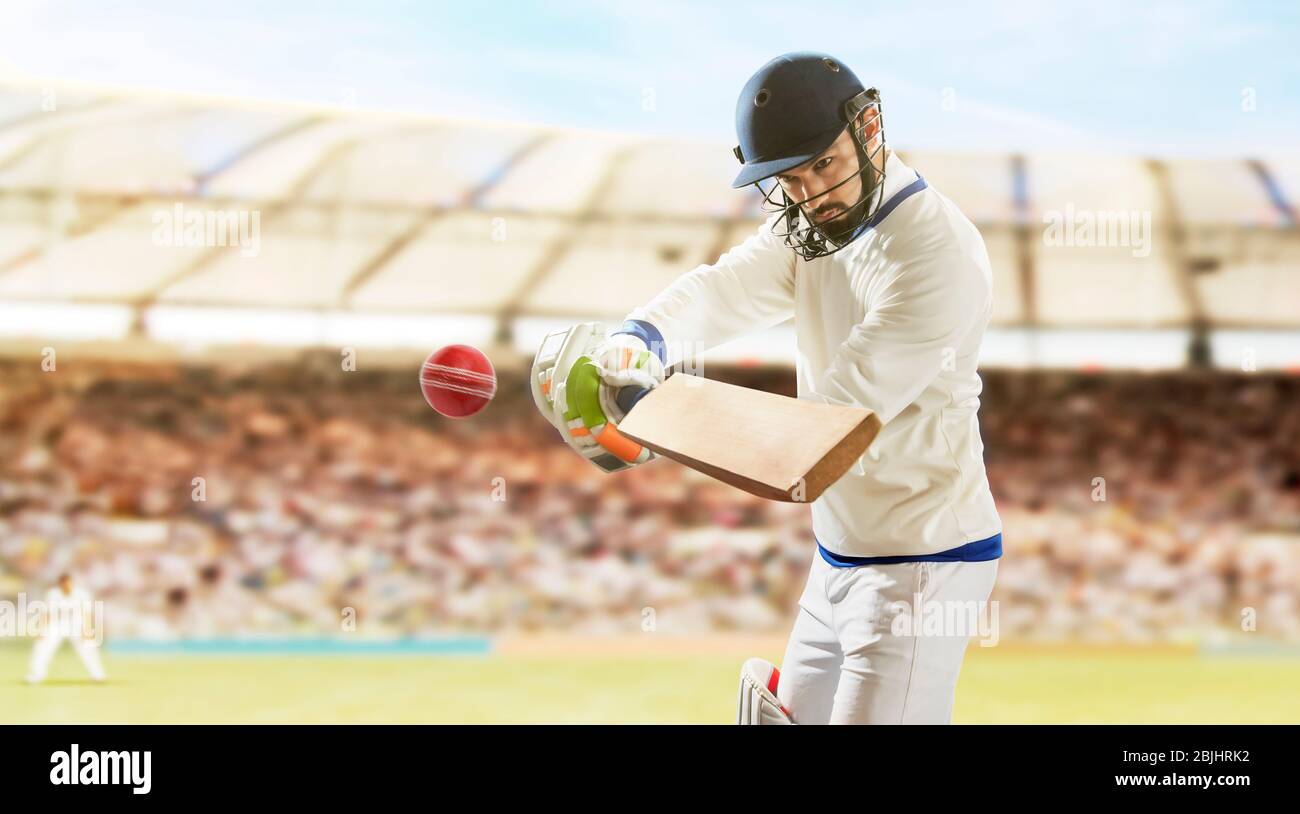 Batsman Hitting Ball During Cricket a Match In Stadium Stock Photo Alamy
